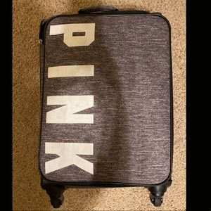 PINK suitcase with mesh hamper